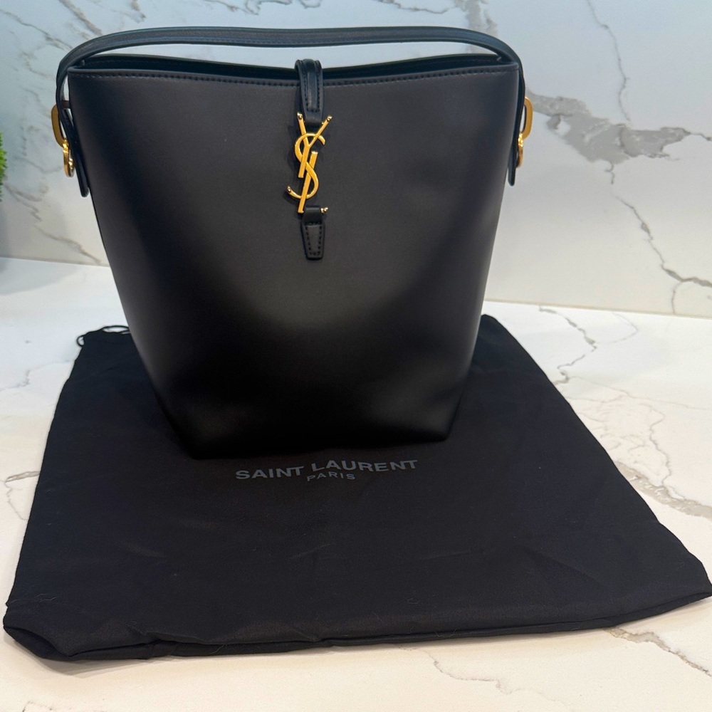 Saint Laurent Black Bucket Bag with removable shoulder strap.